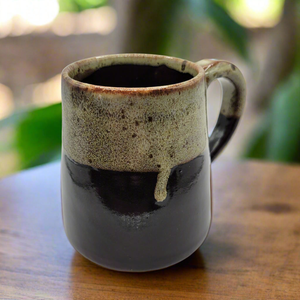 A ceramic mug with a brown and beige design, handcrafted in Texas, with a 12oz capacity.