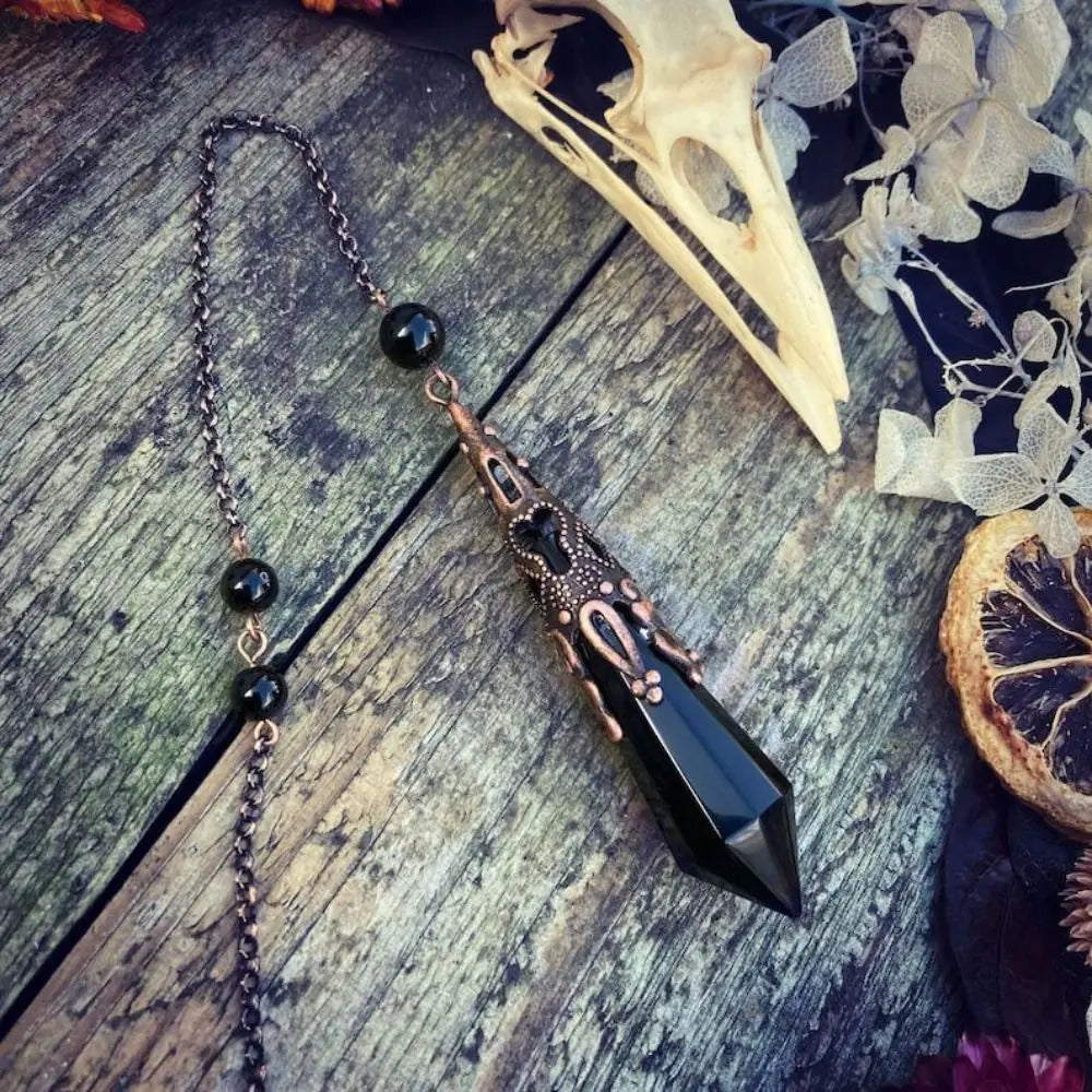 Black Obsidian Crystal Pendulum With Raven Skull